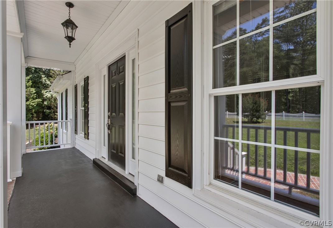 1503 Black Heath Road Midlothian, VA 23113 - Photo 5 of 50 a view of a balcony with a floor to ceiling window and wooden floor