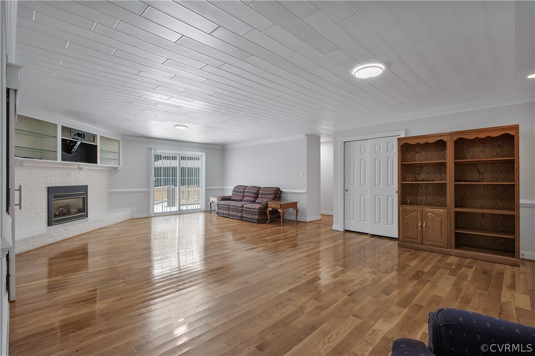 1503 Black Heath Road Midlothian, VA 23113 - Photo 9 of 50 a view of empty room with a fireplace and wooden floor