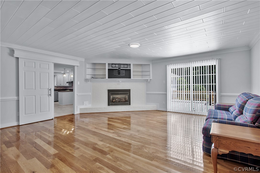 1503 Black Heath Road Midlothian, VA 23113 - Photo 10 of 50 a view of a livingroom with wooden floor and a fireplace