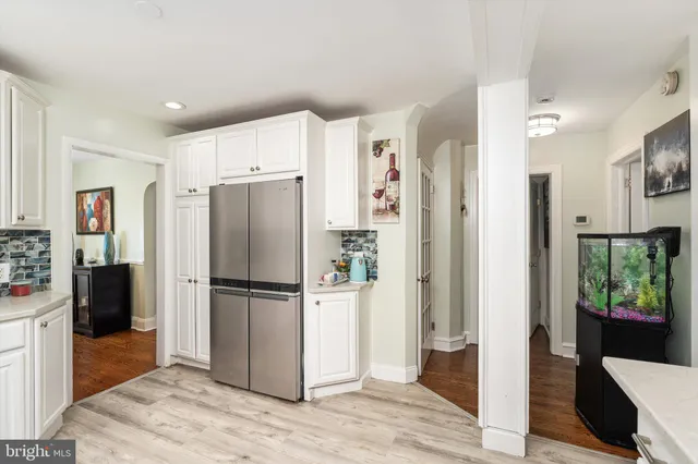 a kitchen with stainless steel appliances a refrigerator and a sink
