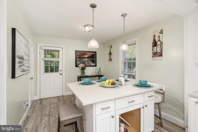 a view of a dining table and chairs in the kitchen