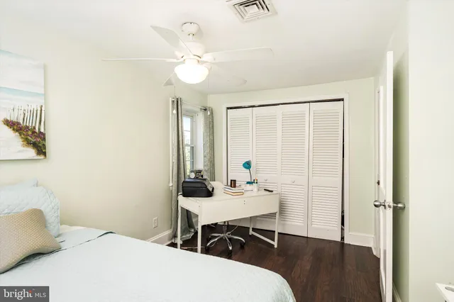 a bedroom with a bed and a table