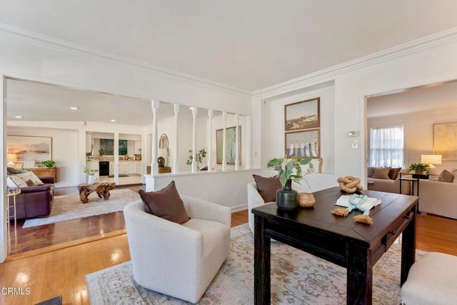 a bedroom with a bed a dresser and a window