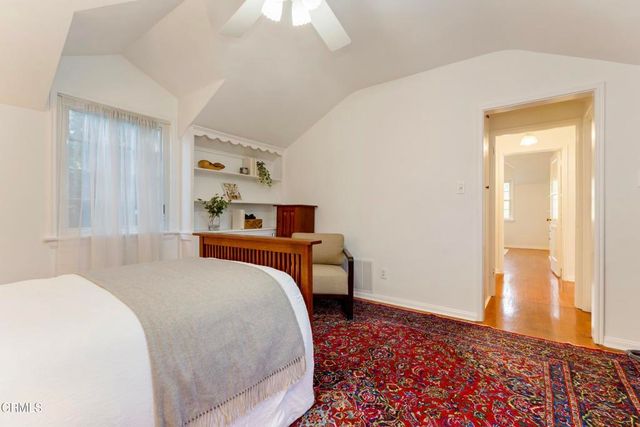 a view of a house with swimming pool and a yard