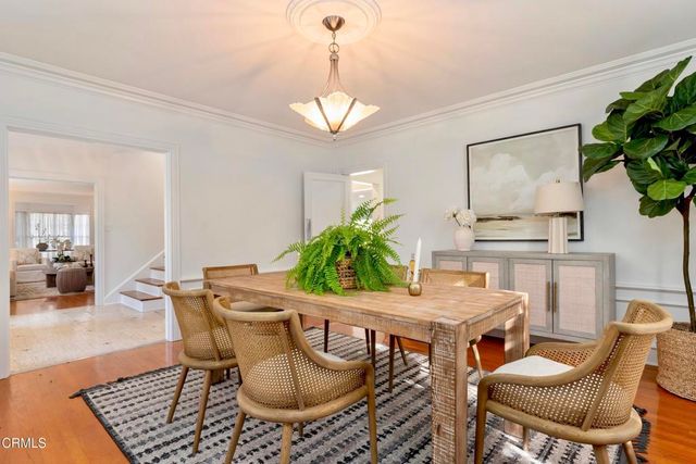 a kitchen with white cabinets and appliances