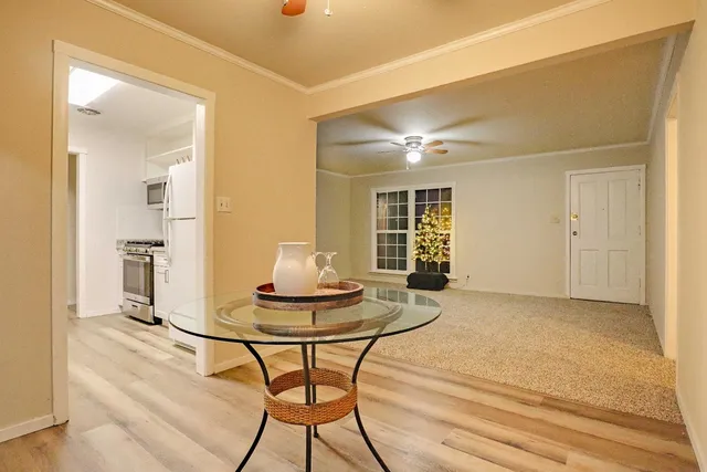 a dining room with furniture and window