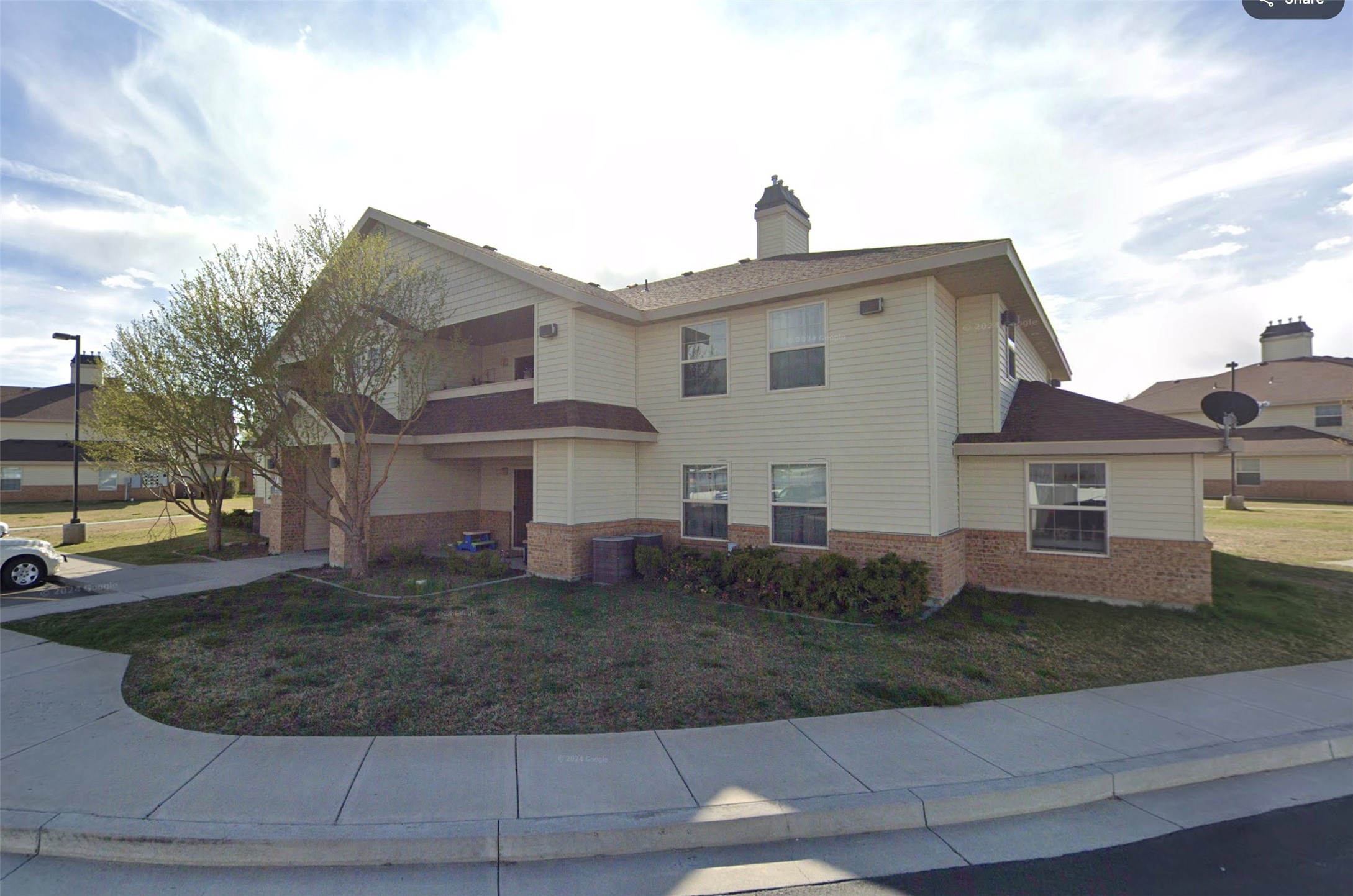 256 West 3rd Street Burley, ID 83318 - Photo 2 of 11 a front view of a house with a yard