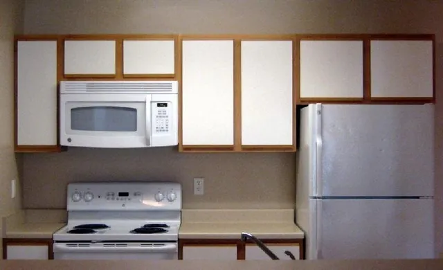 a hallway with a washer and dryer