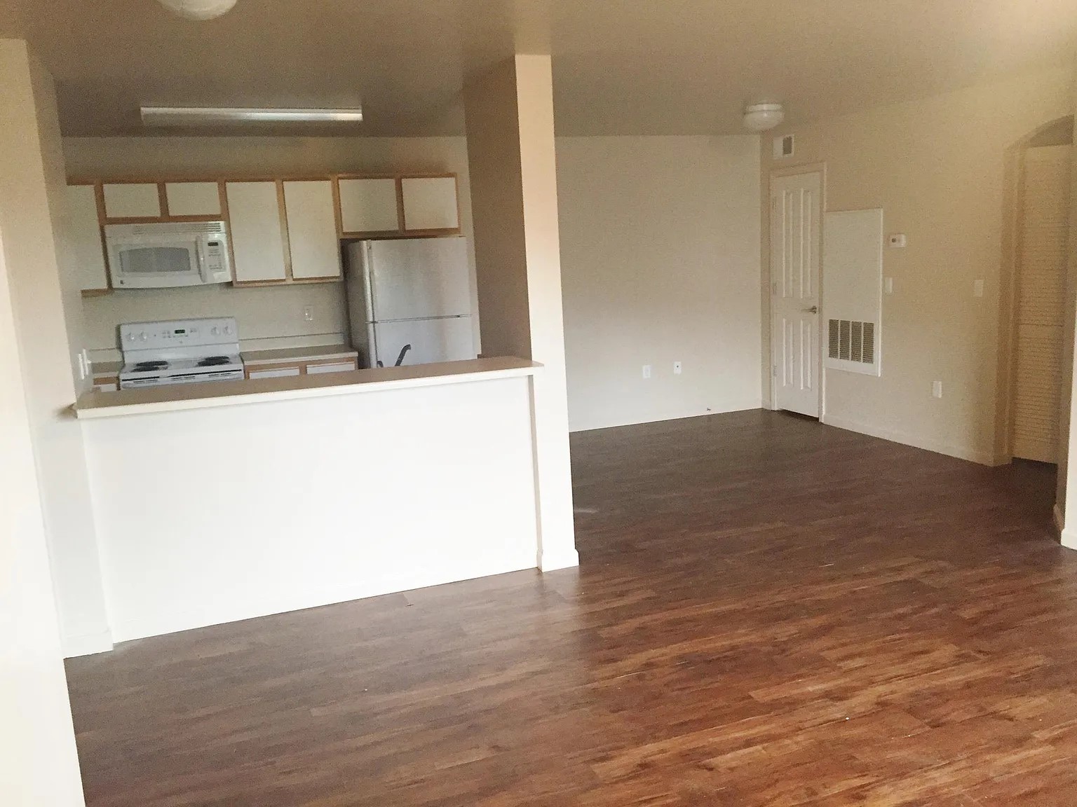 256 West 3rd Street Burley, ID 83318 - Photo 10 of 11 a view of a kitchen with a sink and wooden floor