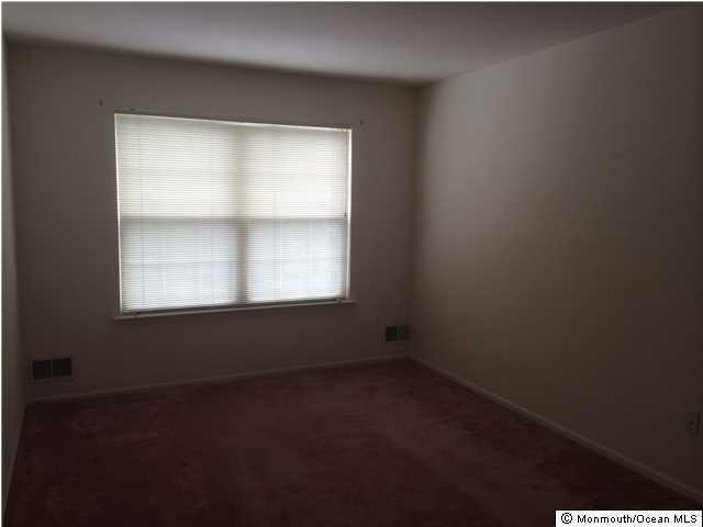 308 Compass Road Manahawkin, NJ 08050 - Photo 17 of 18 a view of an empty room with a window