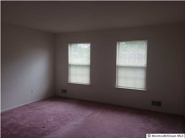 308 Compass Road Manahawkin, NJ 08050 - Photo 9 of 18 an empty room with a window