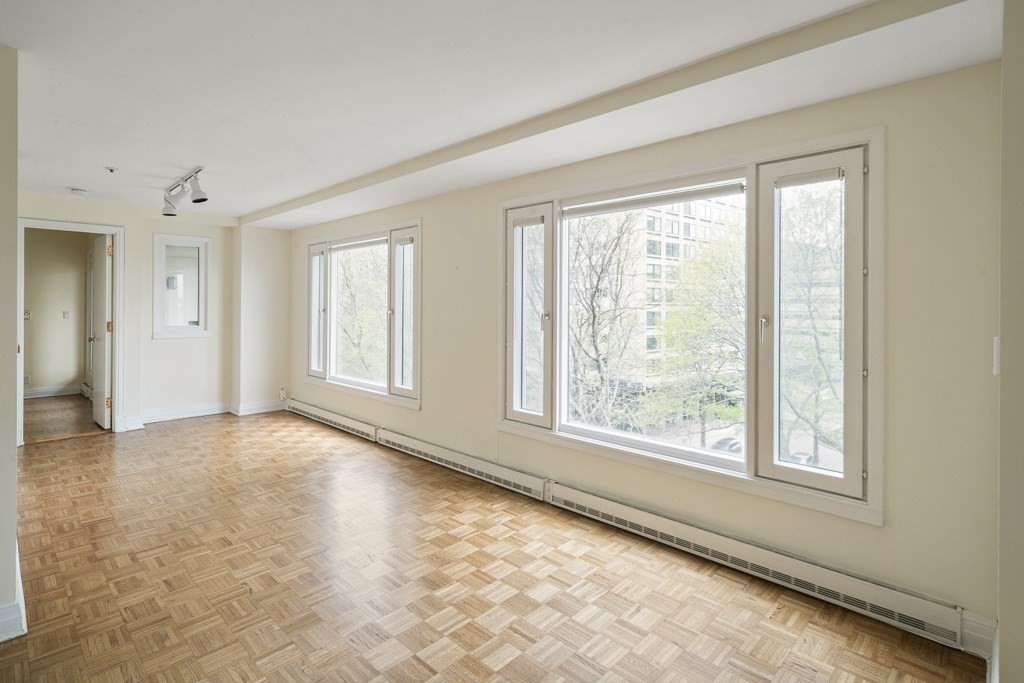 20 Rowes Wharf, Unit 503 Boston, MA 02110 - Photo 16 of 26 a view of an empty room with a window