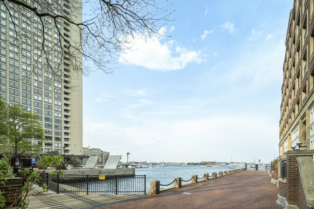 20 Rowes Wharf, Unit 503 Boston, MA 02110 - Photo 3 of 26 a view of a city with tall buildings and lake view