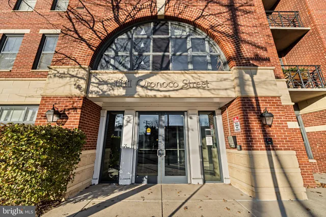 a view of a brick building with many windows