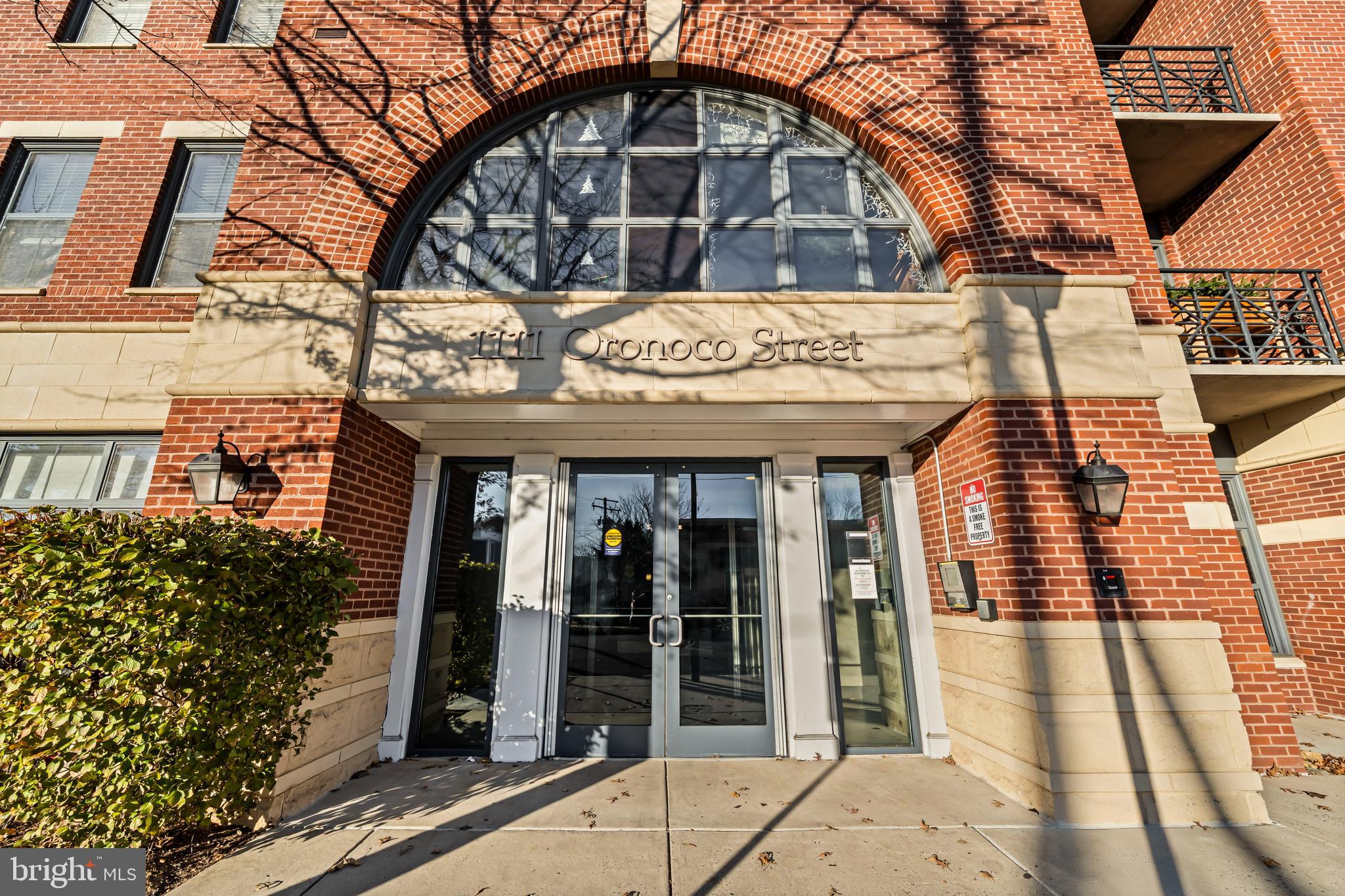 a view of a brick building with many windows