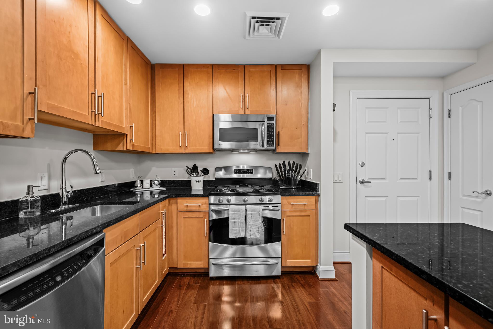 1111 Oronoco Street, Unit 326 Alexandria, VA 22314 - Photo 11 of 54 a kitchen with stainless steel appliances granite countertop a stove and a sink