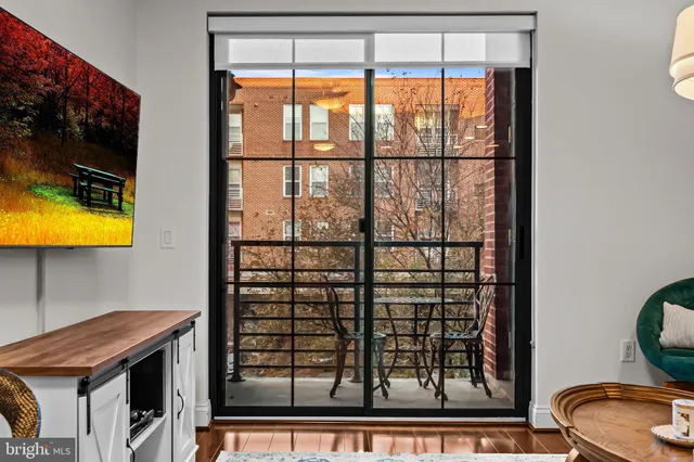 a view of a room that has a bed and a window