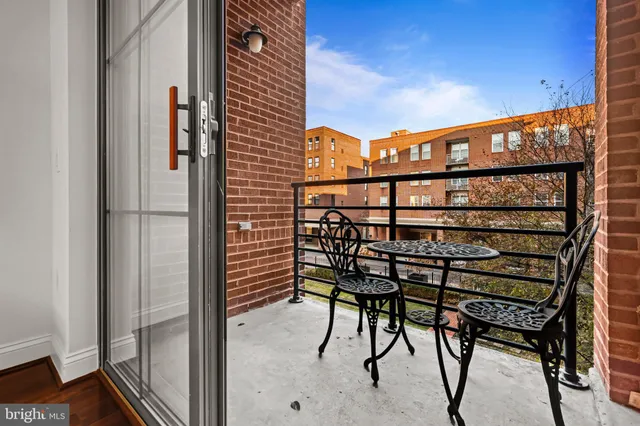 a balcony view with couple of chairs