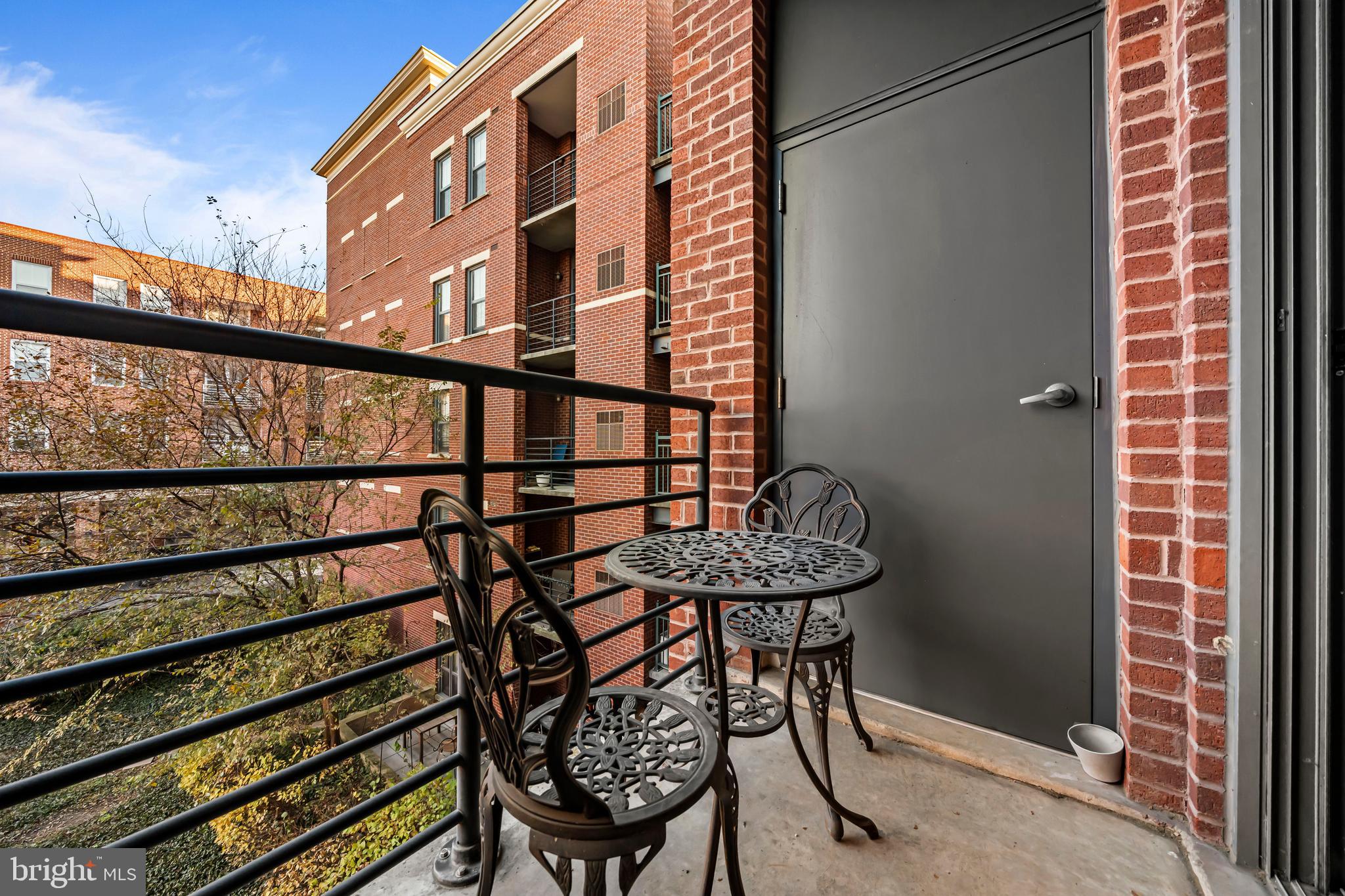 1111 Oronoco Street, Unit 326 Alexandria, VA 22314 - Photo 20 of 54 a balcony view with couple of chairs