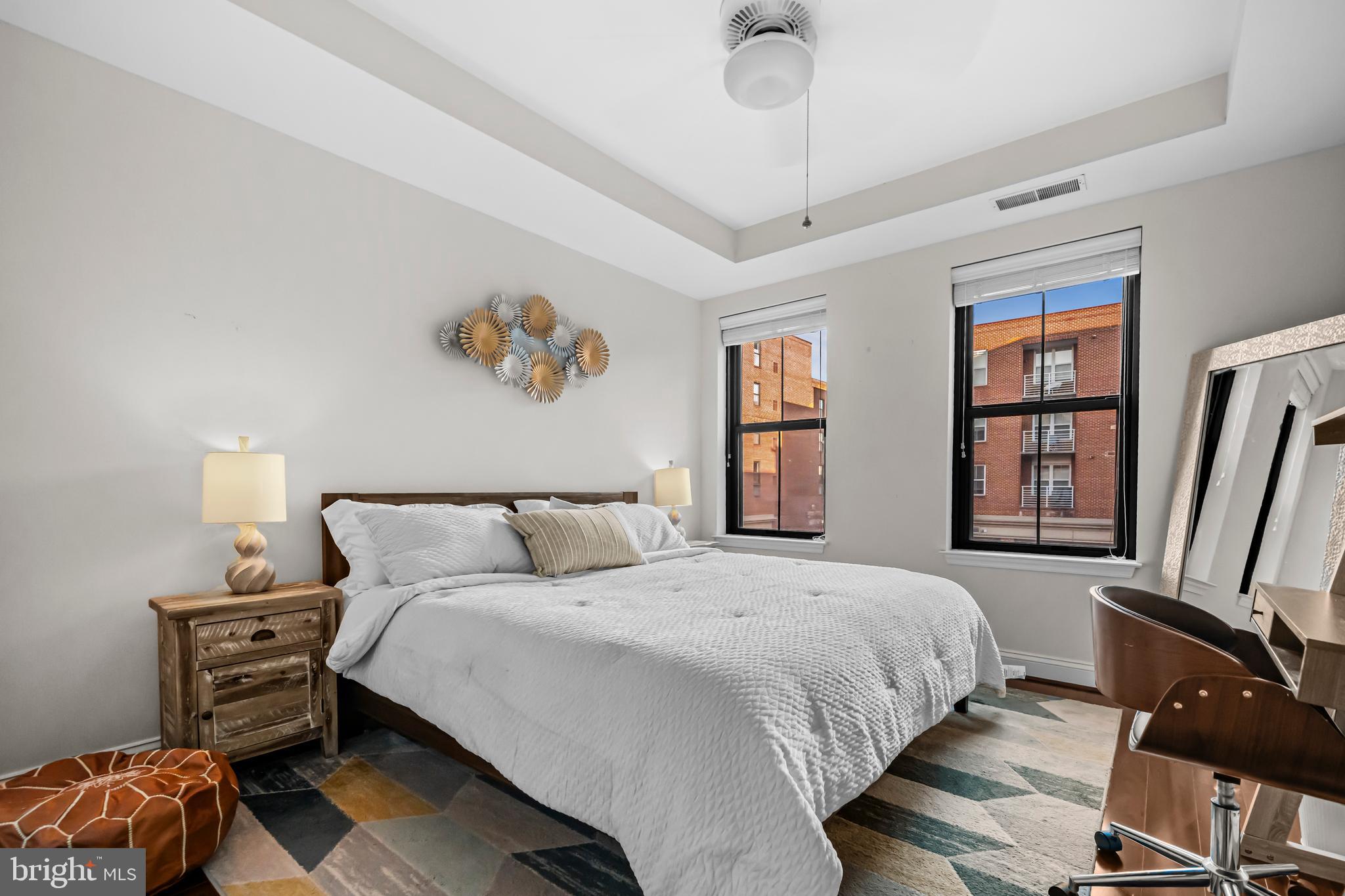 1111 Oronoco Street, Unit 326 Alexandria, VA 22314 - Photo 23 of 54 a bedroom with a bed and wooden floor
