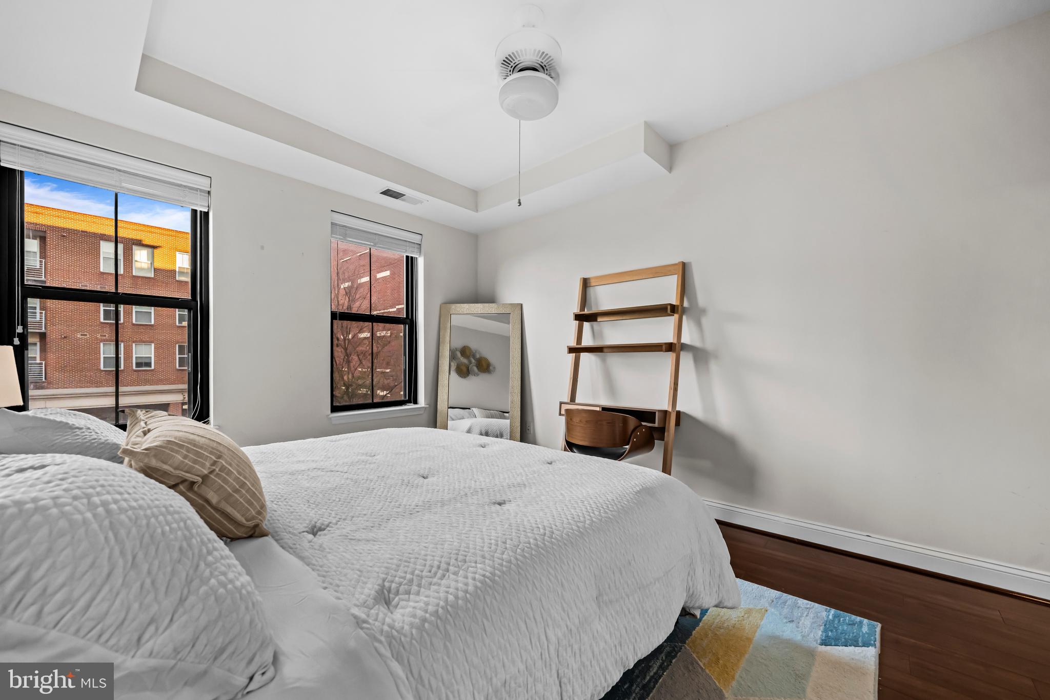 1111 Oronoco Street, Unit 326 Alexandria, VA 22314 - Photo 24 of 54 a bedroom with a bed and a large window