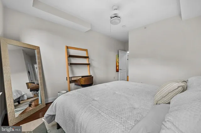 a bedroom with a bed and a couch