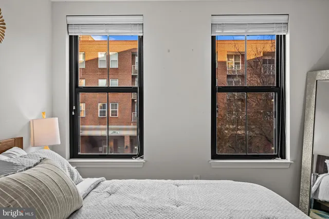 a view of room with window and wooden floor