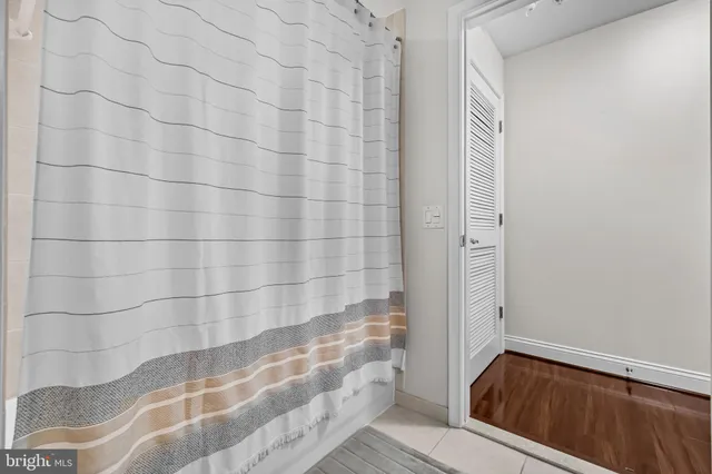 a bathroom with a tub and shower