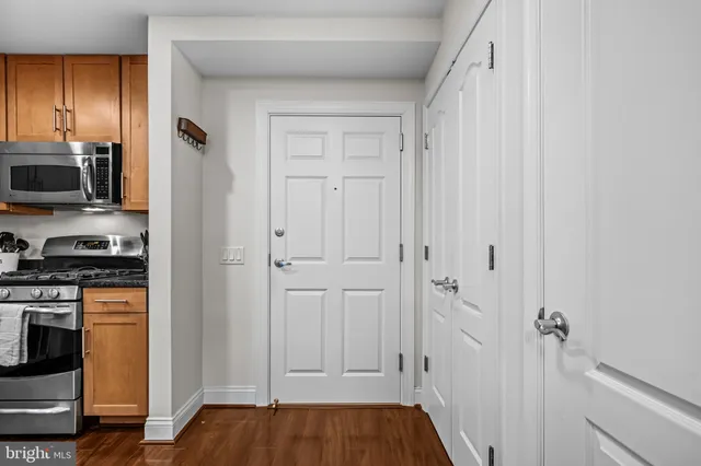 a view of a kitchen from the hallway