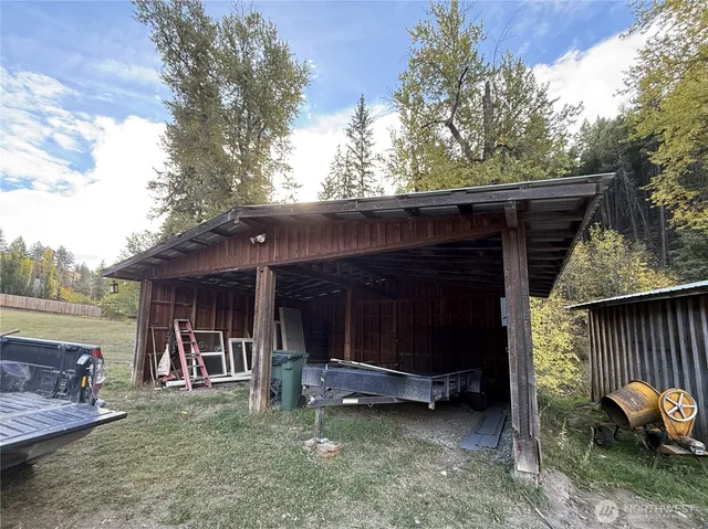 a wooden fence with trees