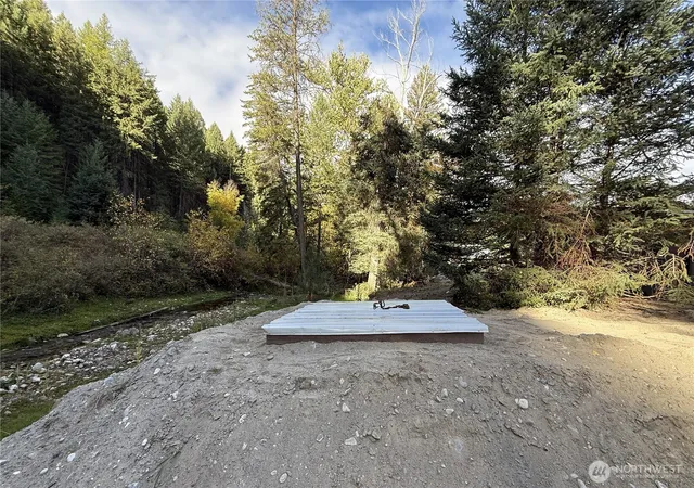 a view of city street with trees all around