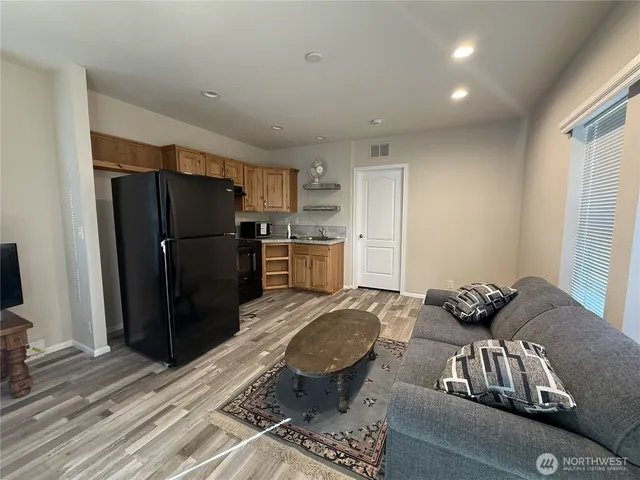 a kitchen with a refrigerator and a sink
