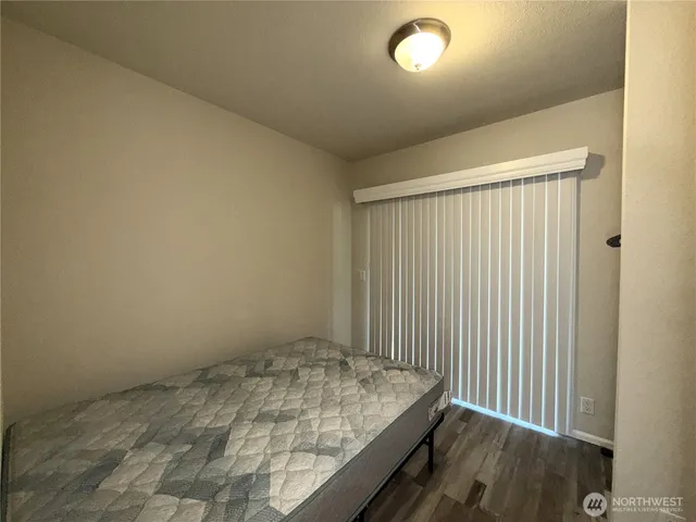 a view of a balcony with wooden floor