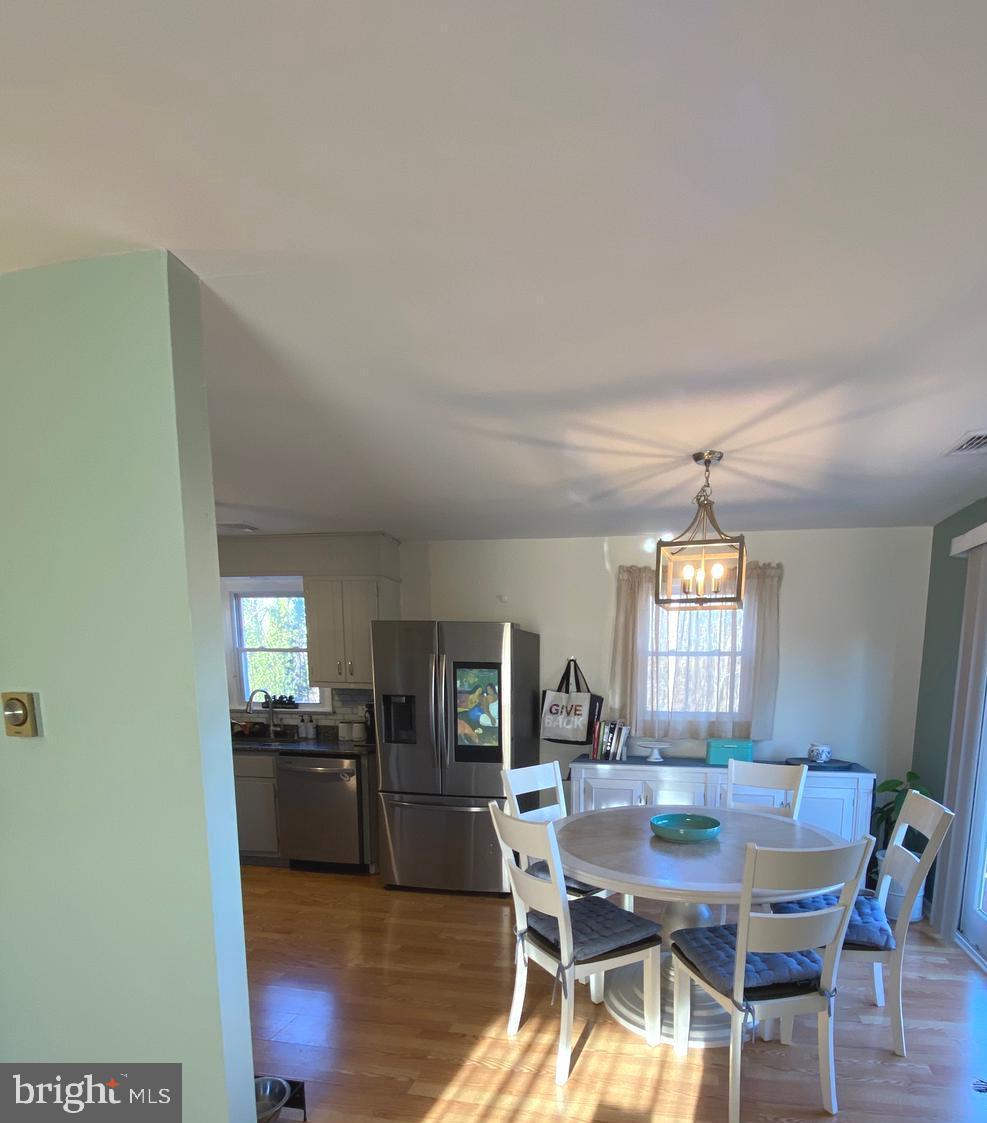 847 Rivendell Lane Pottstown, PA 19464 - Photo 12 of 41 a view of a dining room with furniture window and wooden floor