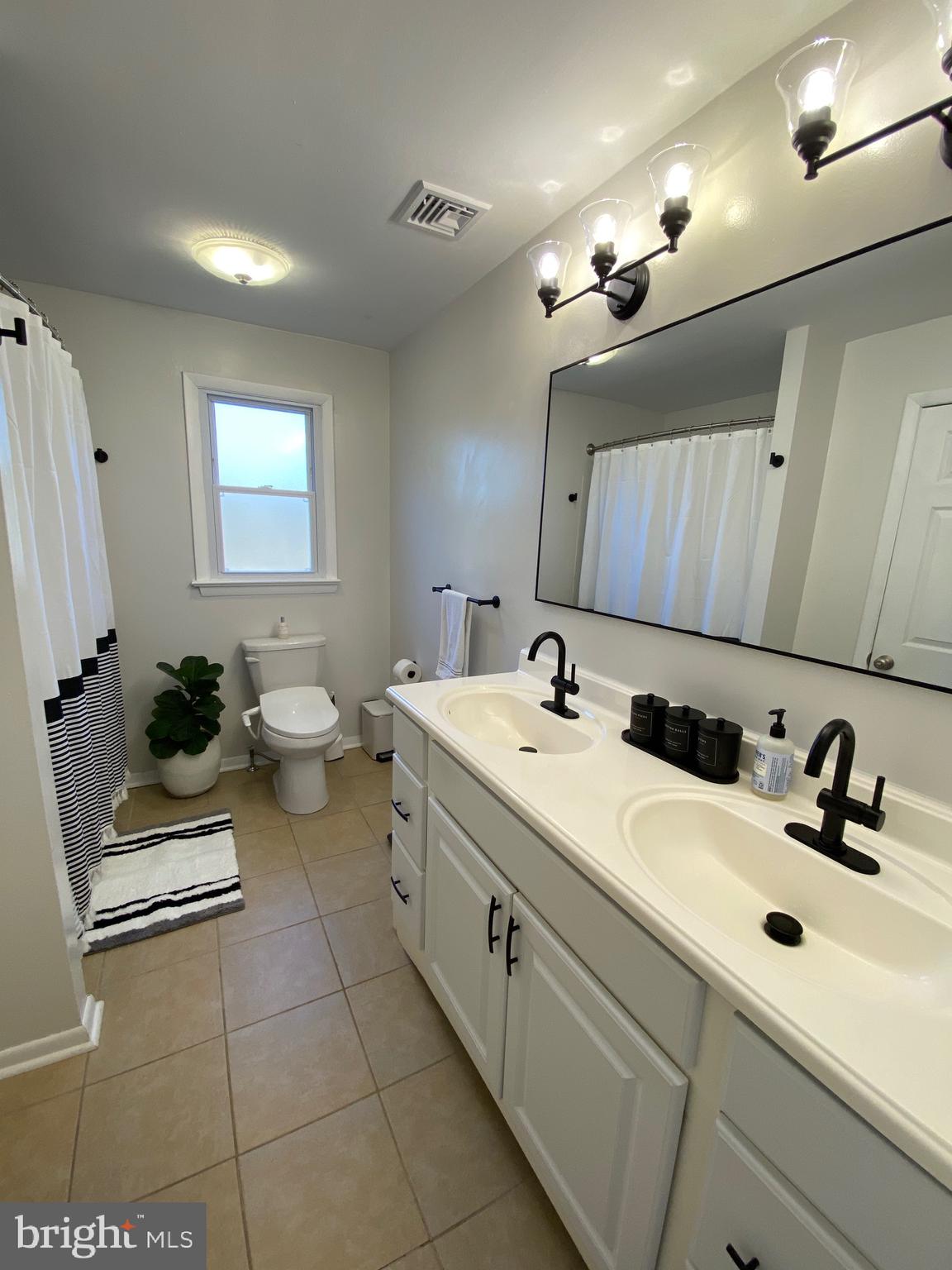 847 Rivendell Lane Pottstown, PA 19464 - Photo 15 of 41 a bathroom with a sink and a mirror