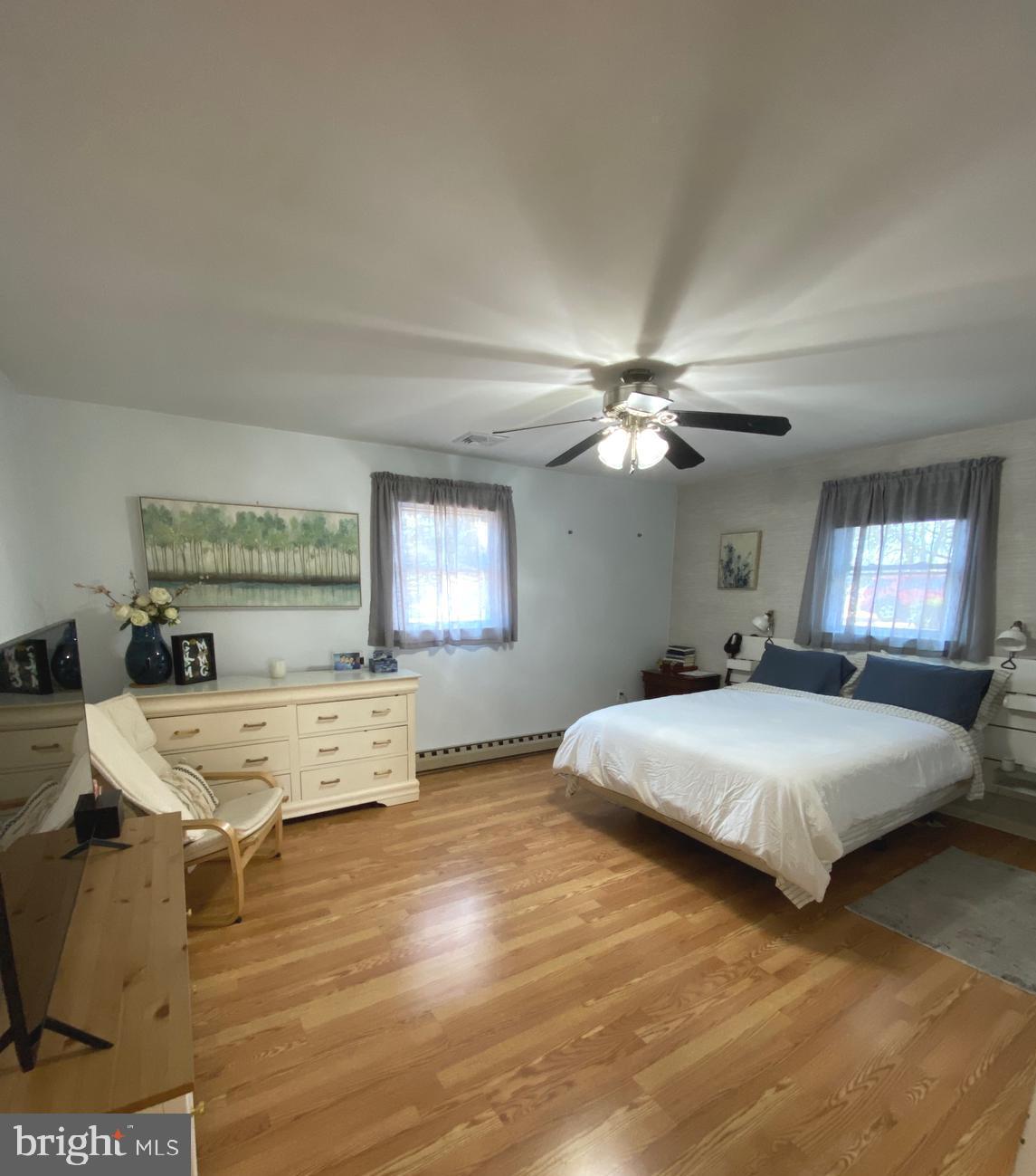 847 Rivendell Lane Pottstown, PA 19464 - Photo 16 of 41 a bedroom with a bed and a chandelier
