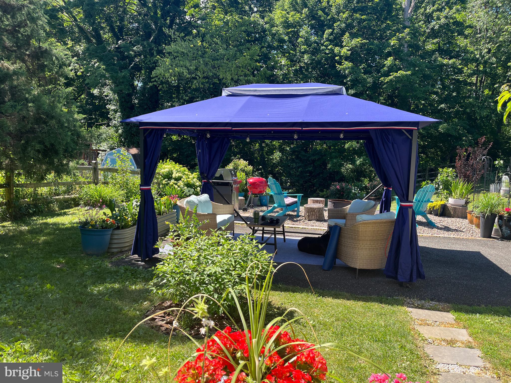 847 Rivendell Lane Pottstown, PA 19464 - Photo 35 of 41 a view of a house with backyard sitting area and garden