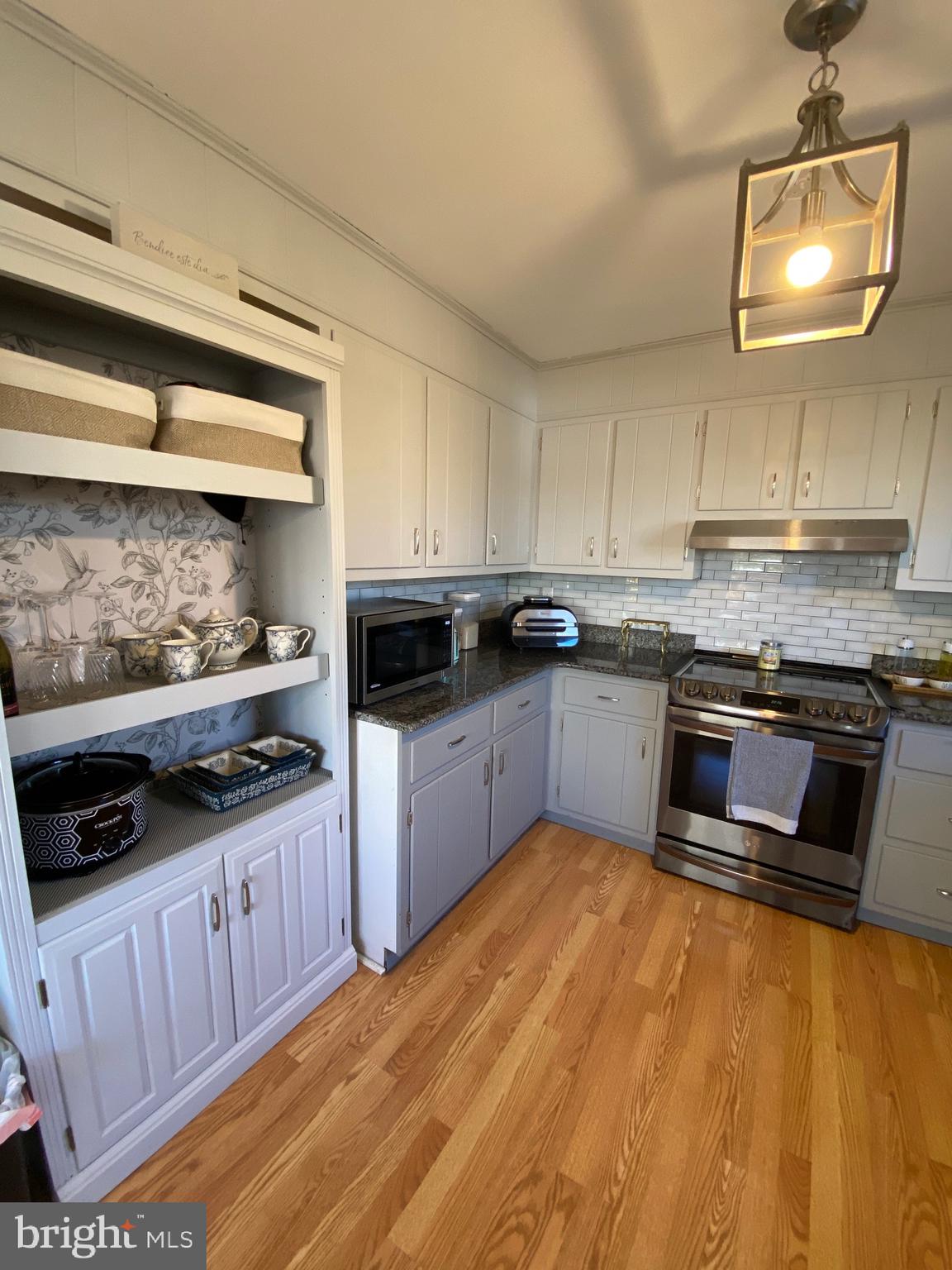847 Rivendell Lane Pottstown, PA 19464 - Photo 10 of 41 a kitchen with stainless steel appliances granite countertop a stove a sink and a microwave