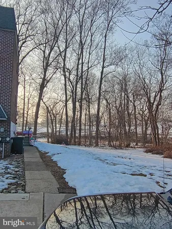 a view of backyard with green space