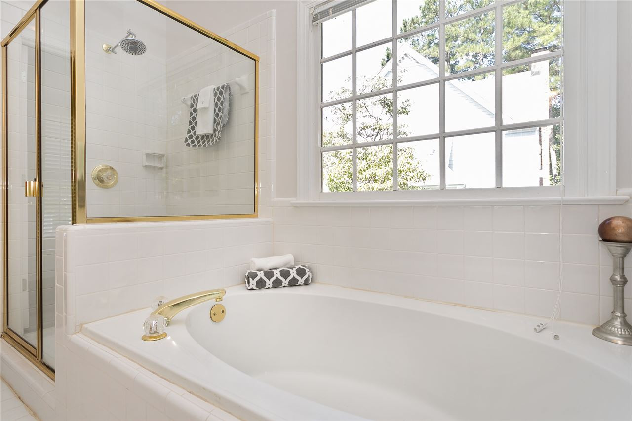 1904 Capers Court Raleigh, NC 27612 - Photo 19 of 29 Tall shower with glass enclosures and beautiful soaker tub with glass window above! Master Bath/Spa