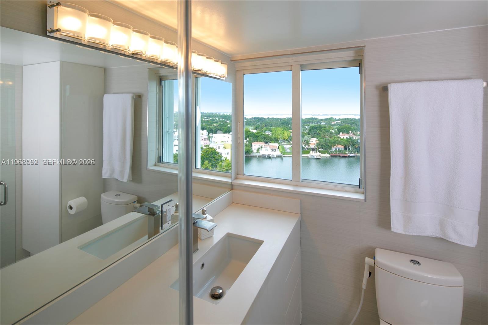 5900 Collins Avenue, Unit 1401 Miami Beach, FL 33140 - Photo 29 of 51 a bathroom with a tub a sink and a vanity