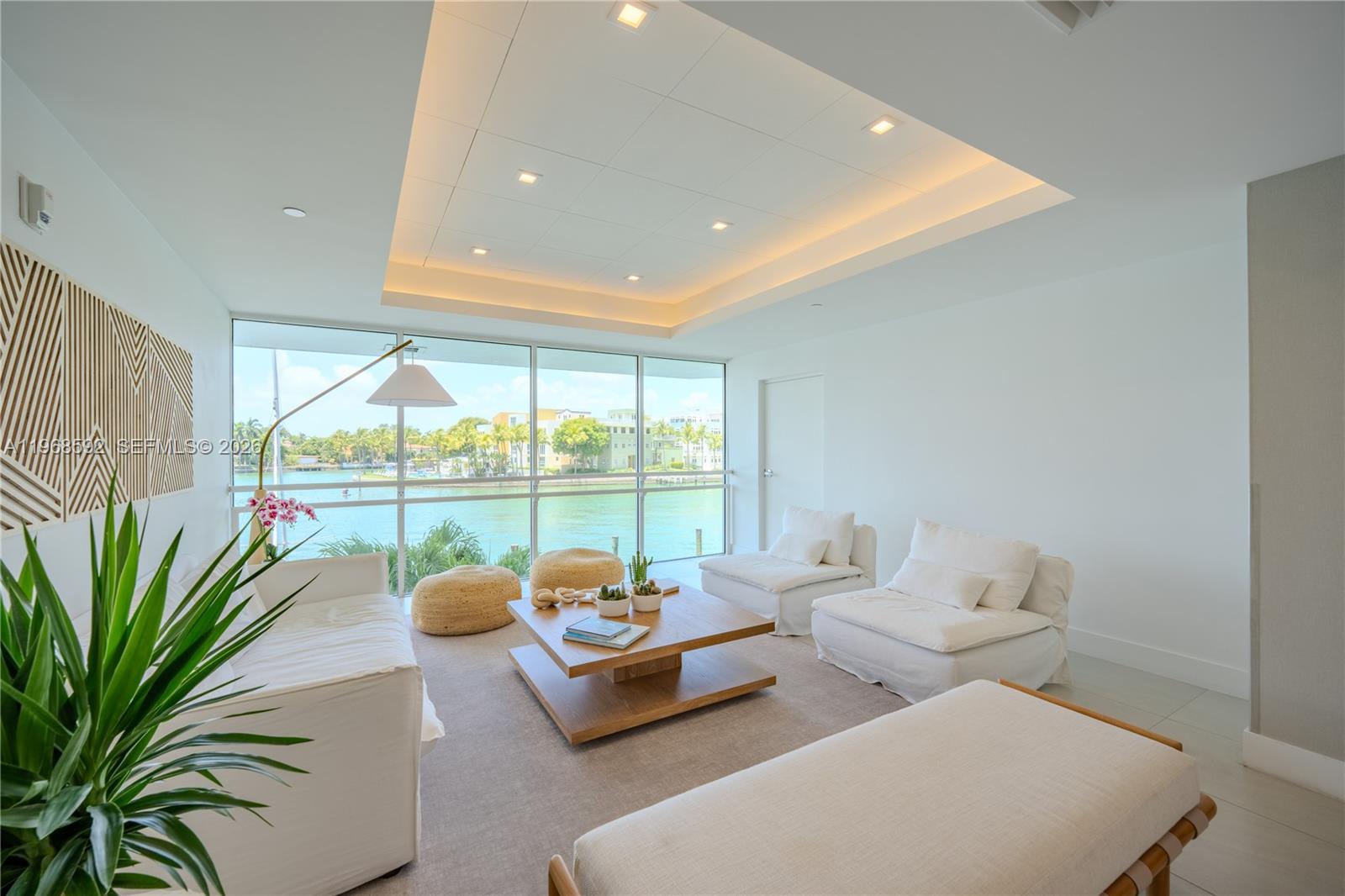 5900 Collins Avenue, Unit 1401 Miami Beach, FL 33140 - Photo 39 of 51 a living room with furniture and a potted plant