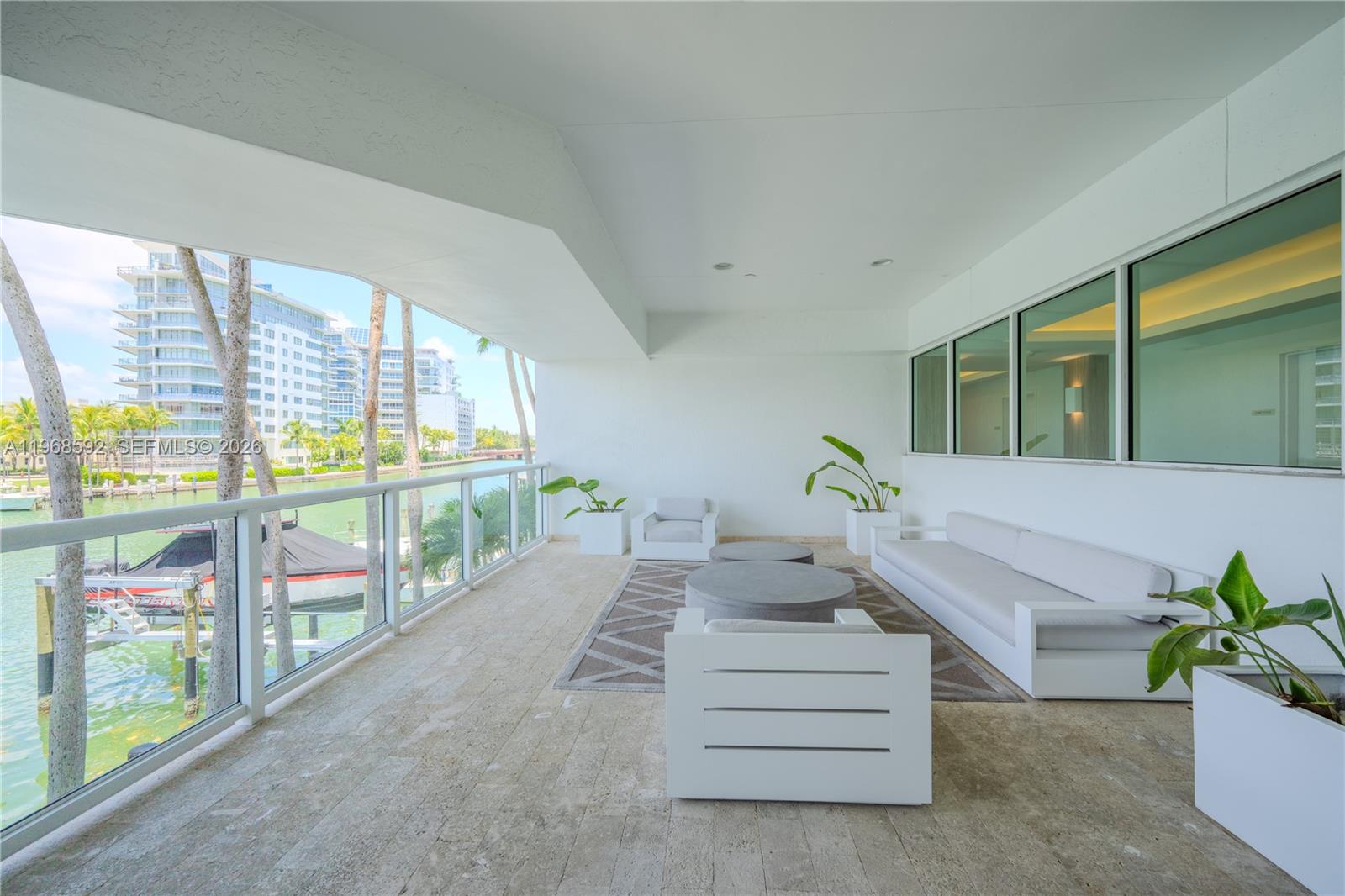 5900 Collins Avenue, Unit 1401 Miami Beach, FL 33140 - Photo 46 of 51 a living room with furniture and a large window