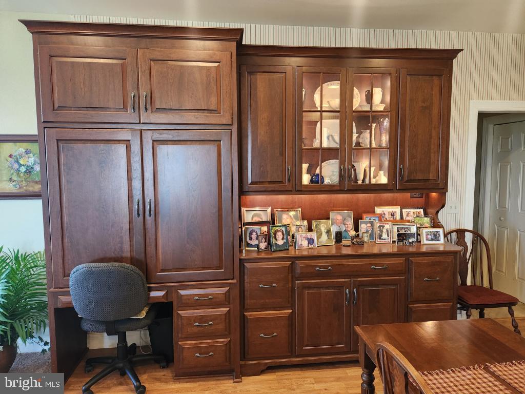 1043 Spring Valley Road Quarryville, PA 17566 - Photo 35 of 79 a kitchen with granite countertop a refrigerator and a wooden cabinets