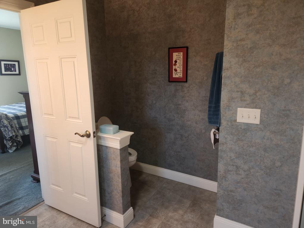 1043 Spring Valley Road Quarryville, PA 17566 - Photo 42 of 79 a bathroom with a toilet and a shower