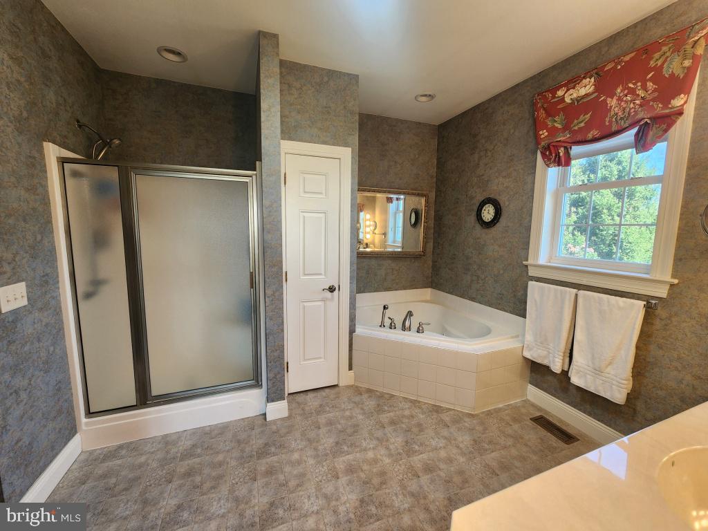 1043 Spring Valley Road Quarryville, PA 17566 - Photo 44 of 79 a bathroom with a tub shower and a sink