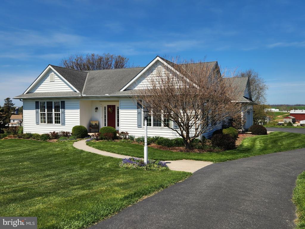1043 Spring Valley Road Quarryville, PA 17566 - Photo 7 of 79 a front view of a house with a yard