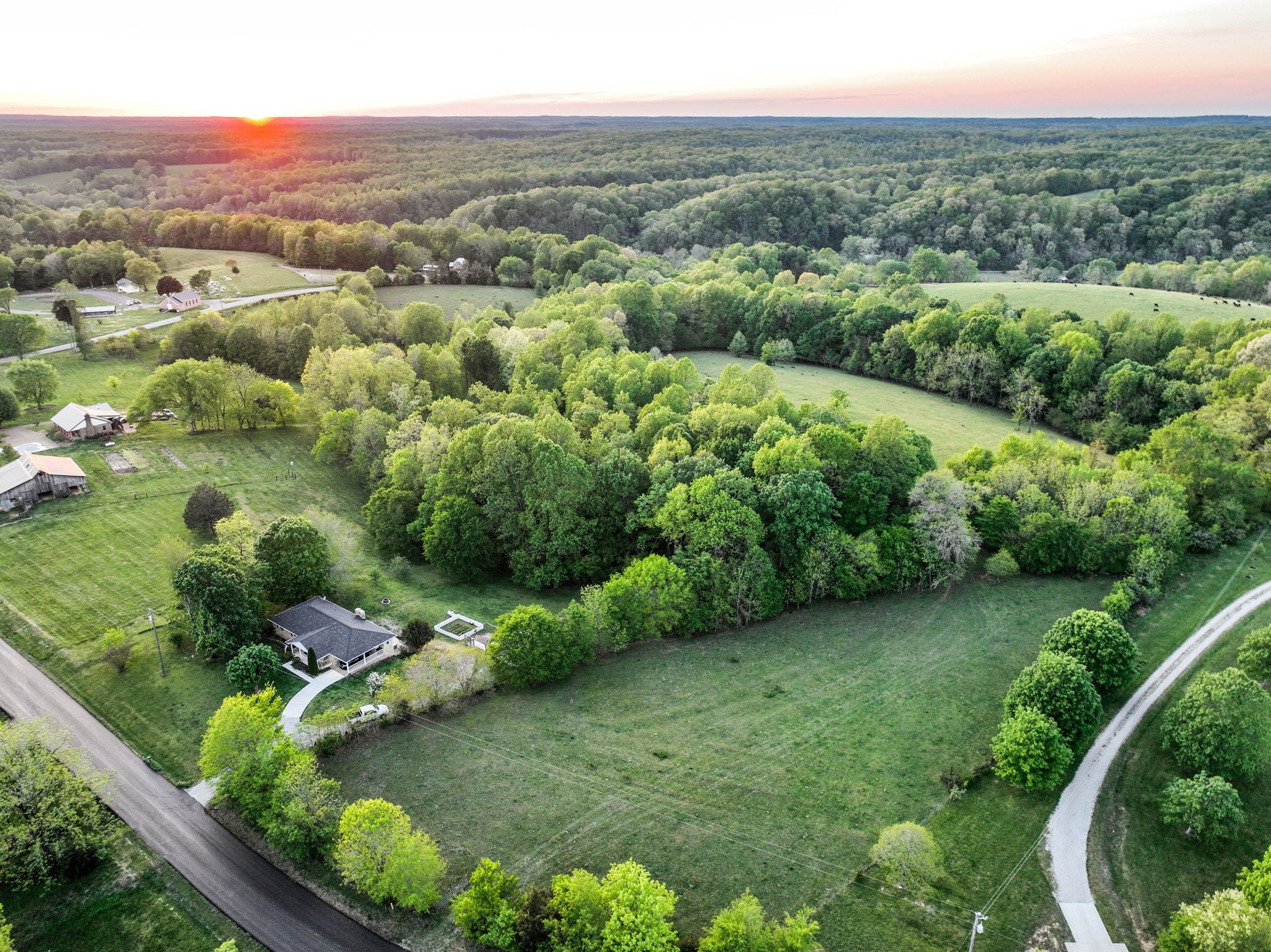 15 Greenbriar Road Franklin, TN 37064 - Photo 54 of 63 an aerial view of green landscape with trees houses and mountain view