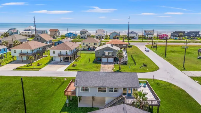 a aerial view of a house with a swimming pool