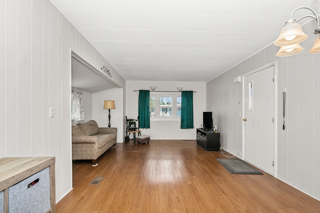 58 Bally Drive Raynham, MA 02767 - Photo 4 of 9 a living room with furniture and a wooden floor